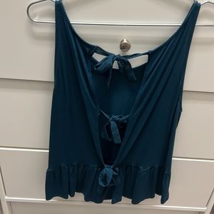 Turquoise sleeveless blouse, 3 bows on the back
